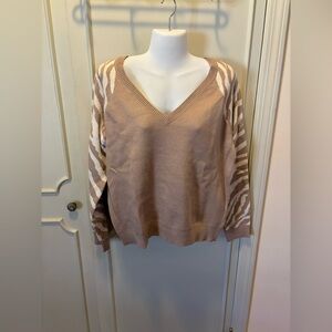 Tan sweater with animal print sleeves. New never worn with tags.